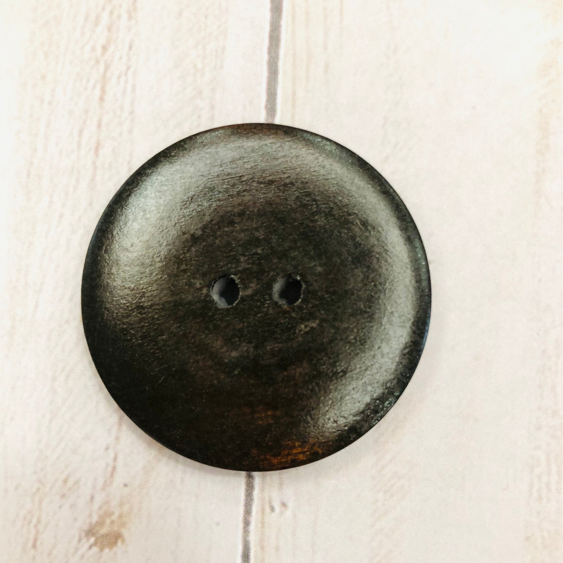 Ebony-colored wood buttons by Sierra and Pine